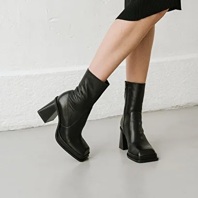 Platform boots with square toe in black leather