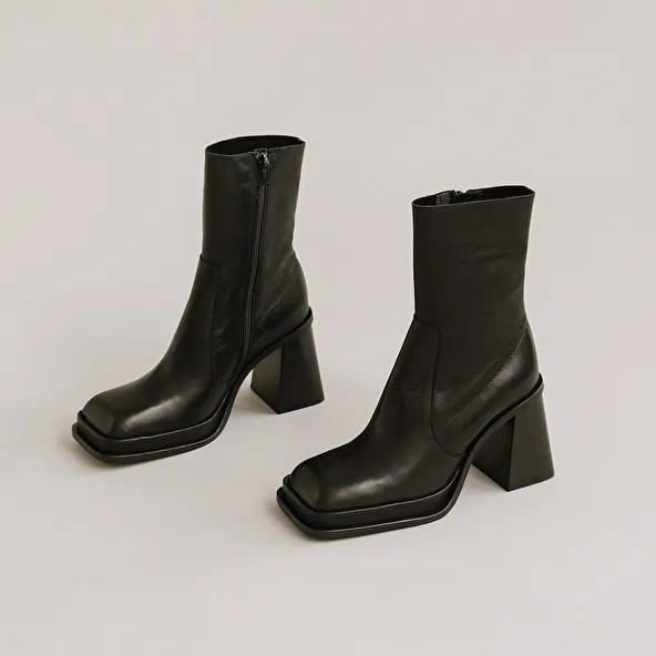 Platform boots with square toe in black leather