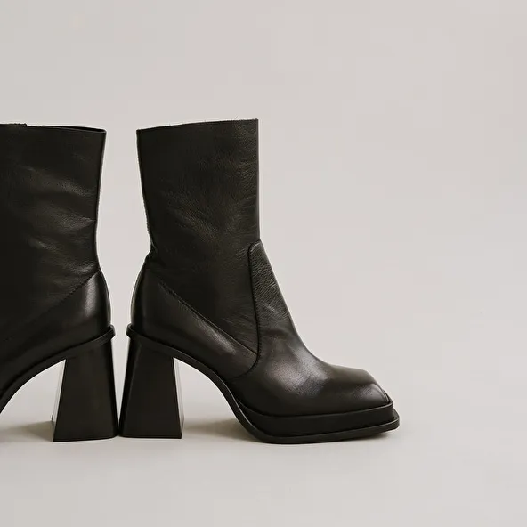 Platform boots with square toe in black leather