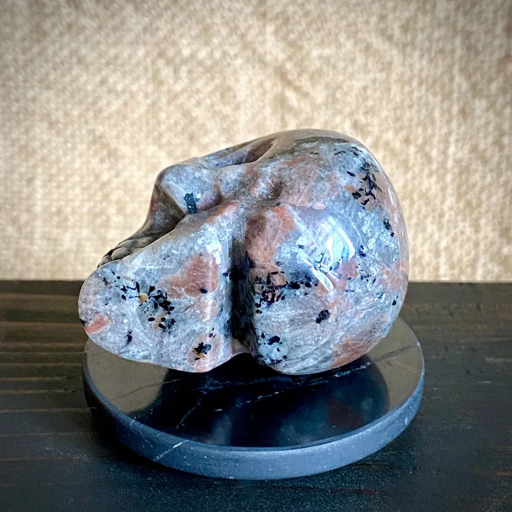 Small Yooperlite aka Glowalite Carved Skull on Polished Shungite Disk